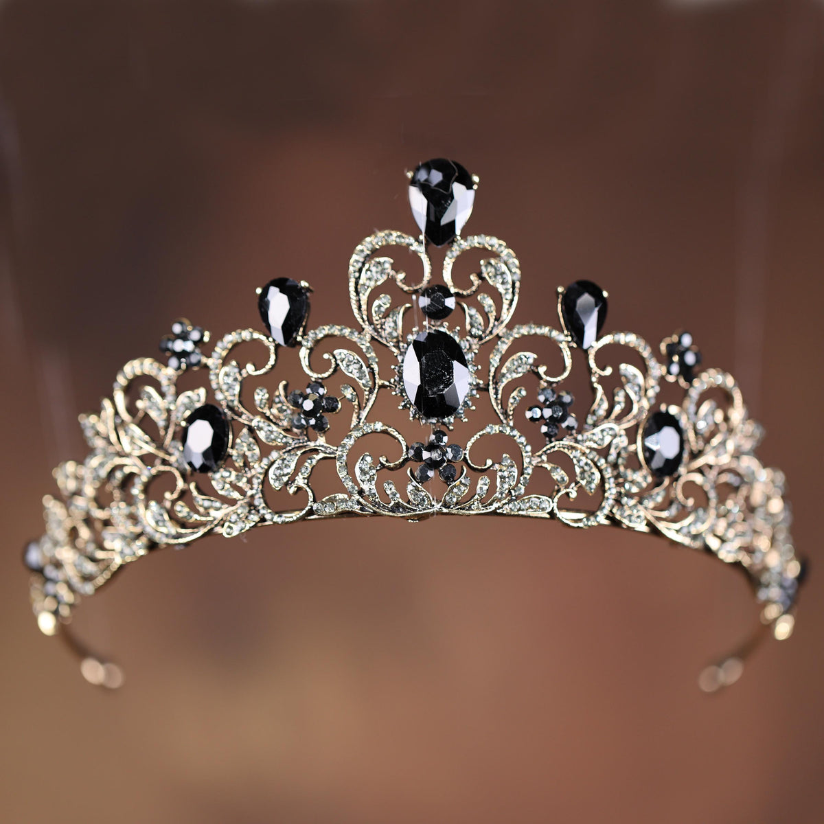 a tiara with black and white stones on it