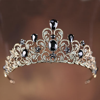 a tiara with black and white stones on it