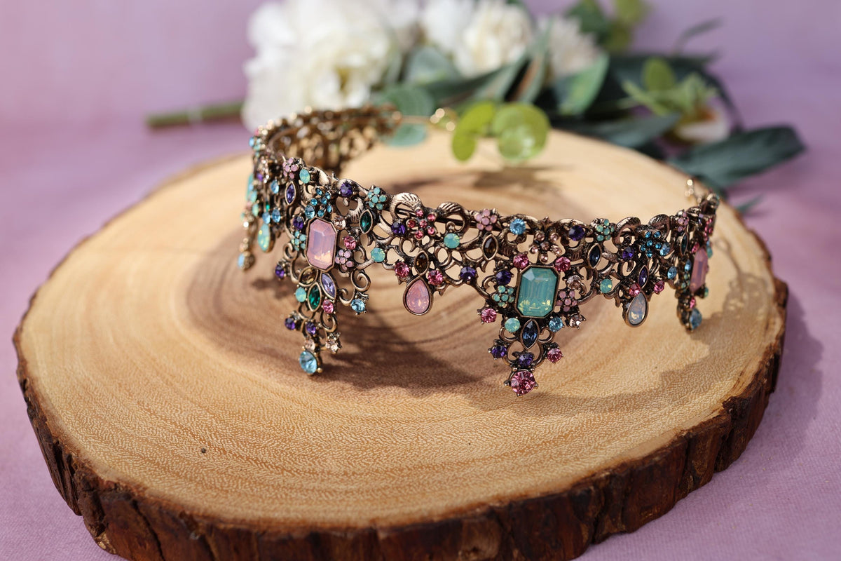 a close up of a piece of wood with jewelry on it