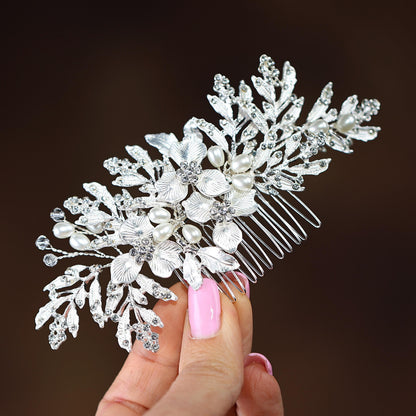 a close up of a person holding a hair comb