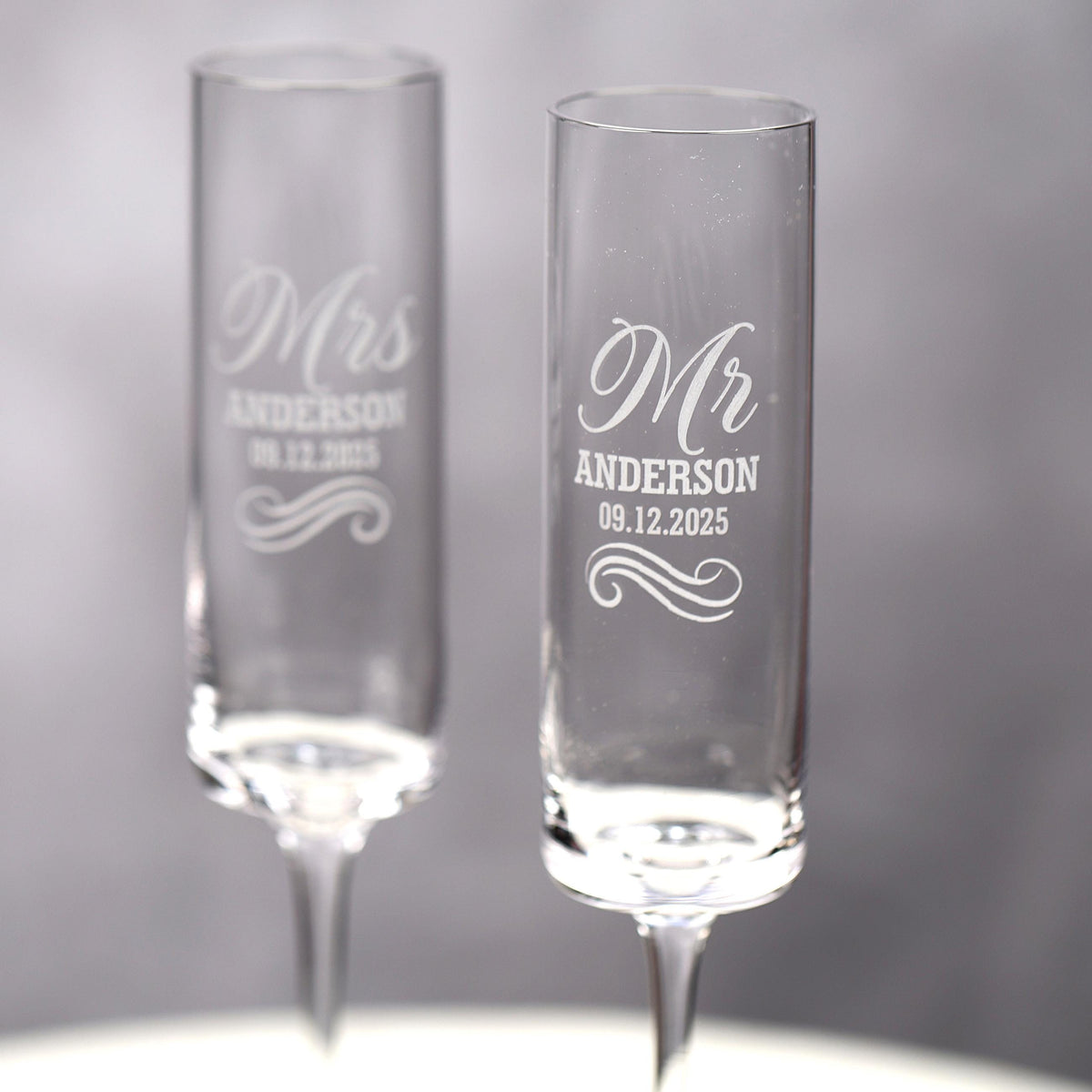 a couple of wine glasses sitting on top of a table