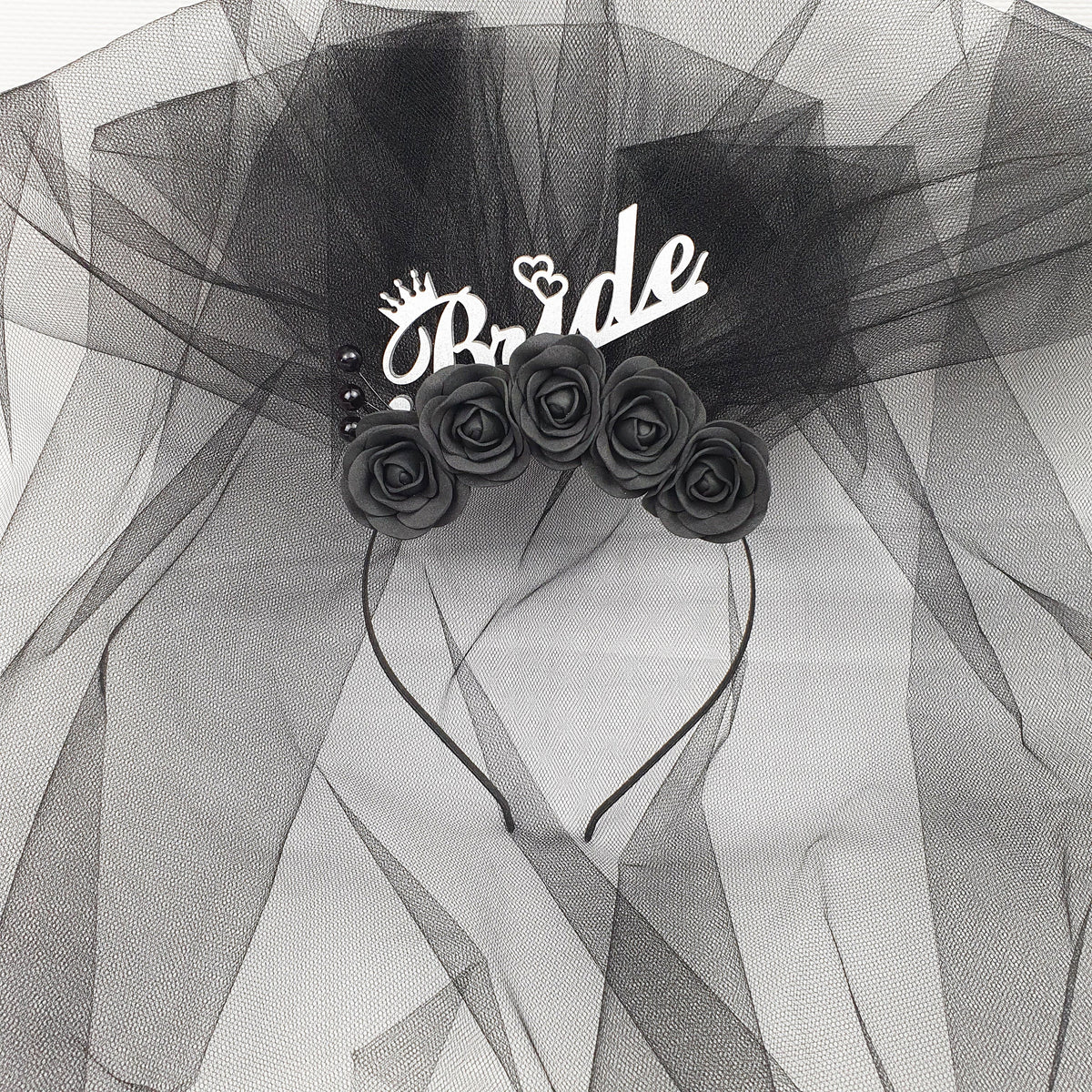 a black and white photo of a bride's hair comb