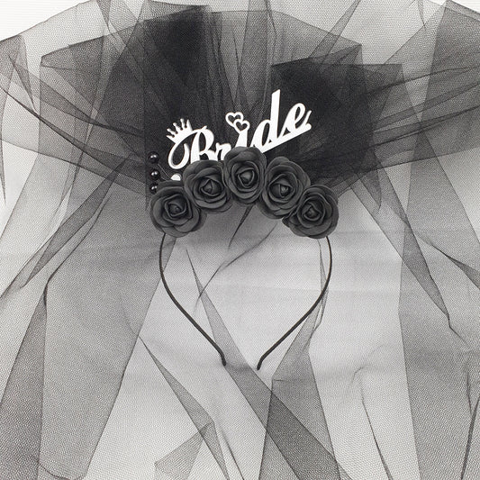 a black and white photo of a bride's hair comb