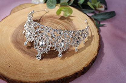 a close up of a tiara on a piece of wood