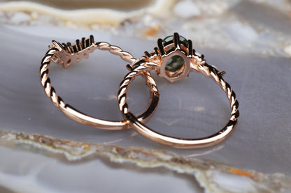 a couple of rings sitting on top of a marble slab
