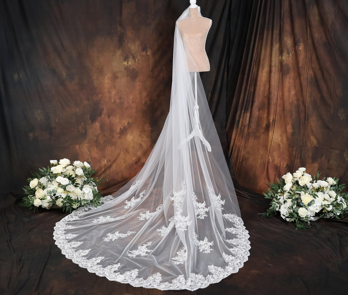 a wedding dress on a mannequin with flowers