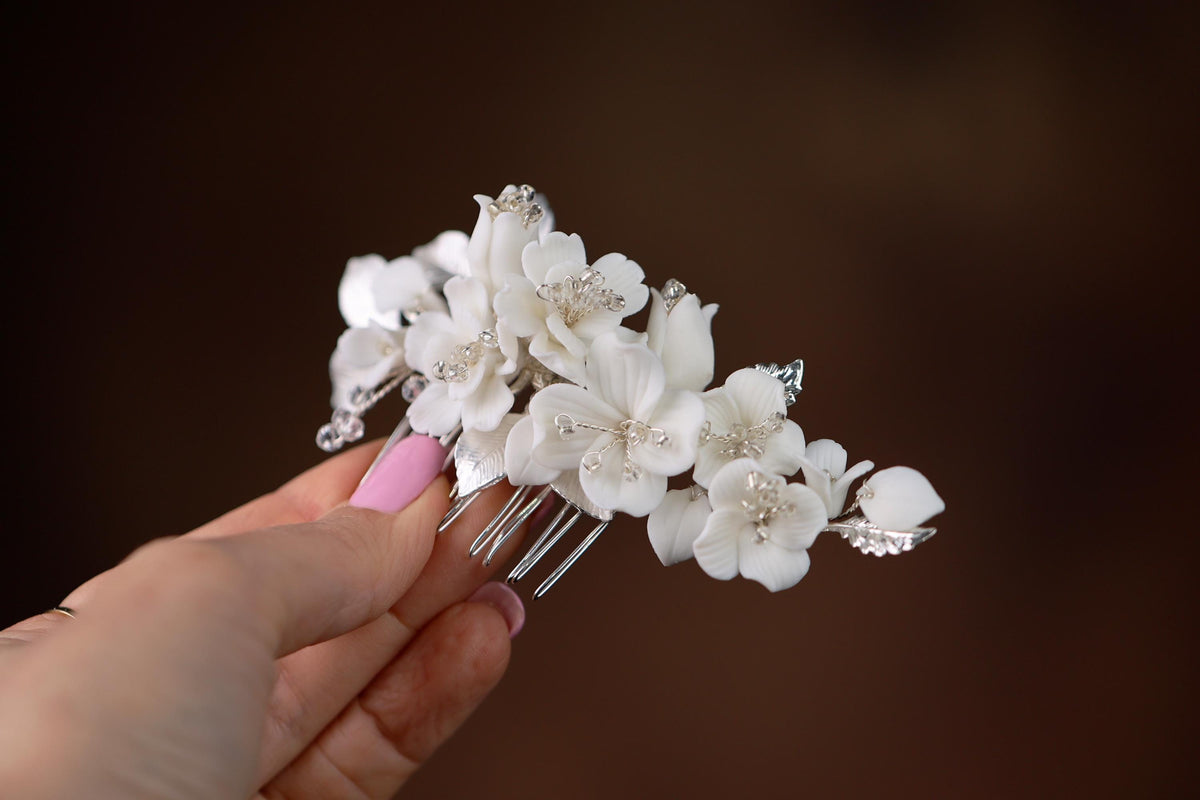 a person holding a bunch of flowers in their hand
