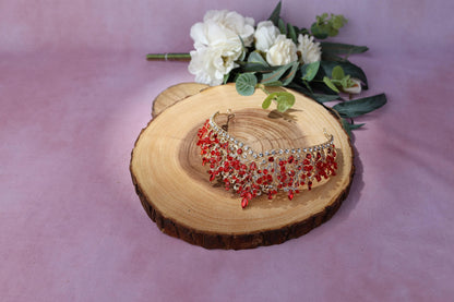a flower and a tiara on a piece of wood