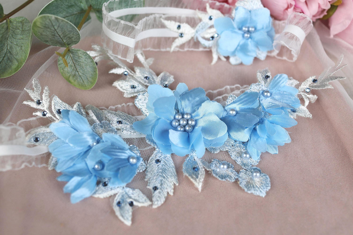 a blue flower headband and a pink flower headband