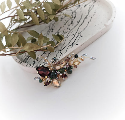 a close up of a pair of earrings on a white surface