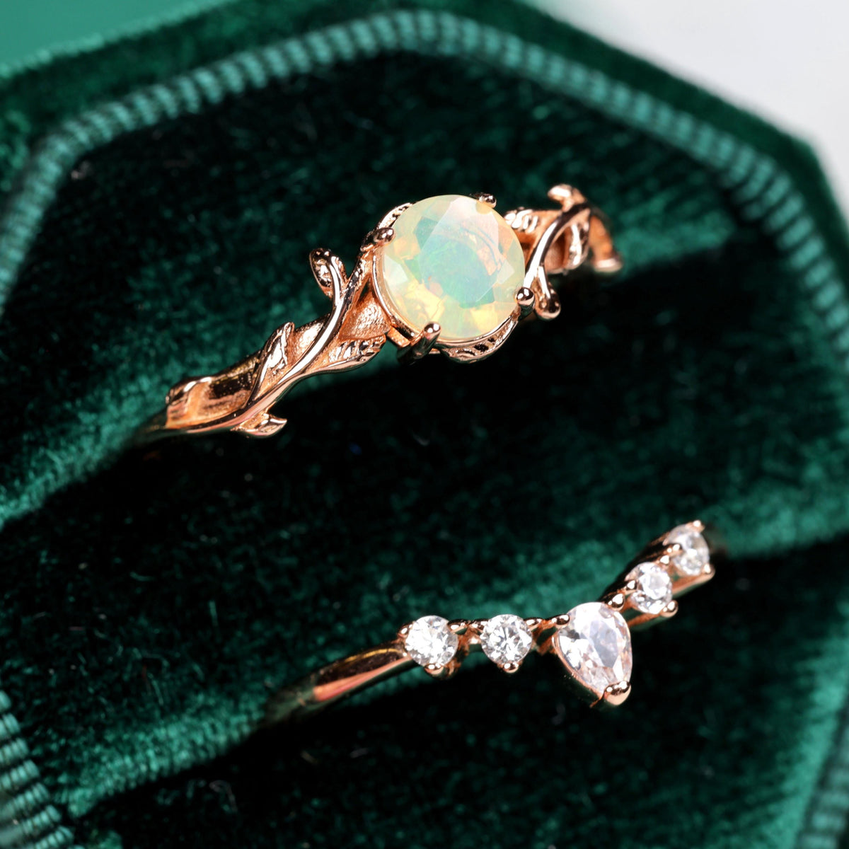 a close up of two rings in a velvet case