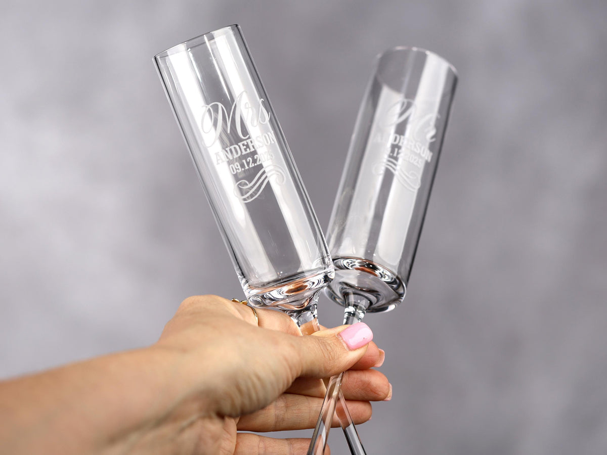 a person holding two wine glasses in their hands