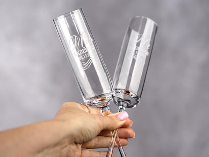 a person holding two wine glasses in their hands