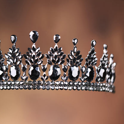 a tiara with black and white jewels on it