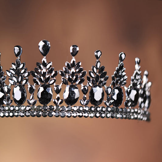 a tiara with black and white jewels on it