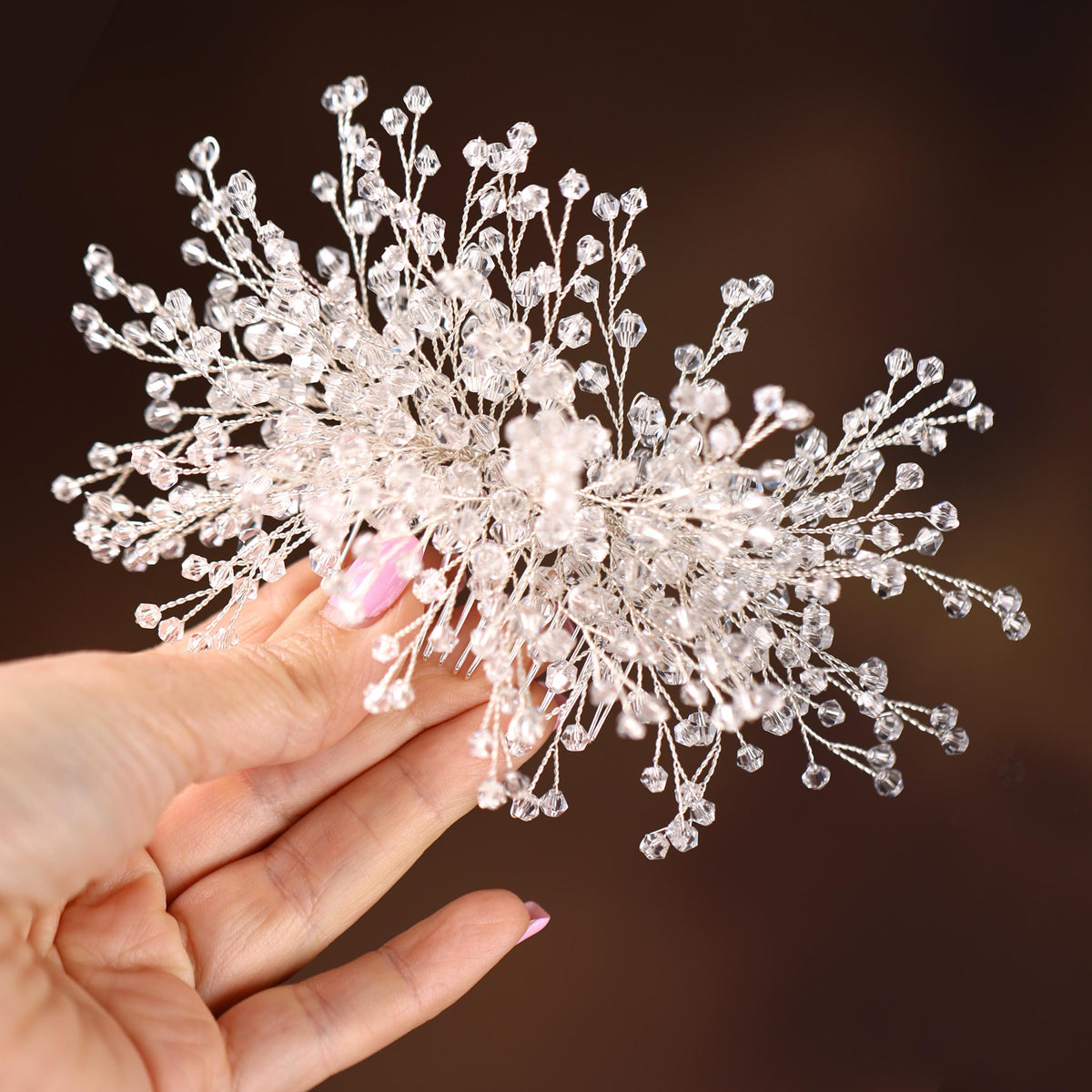 a hand holding a fake flower in it's palm