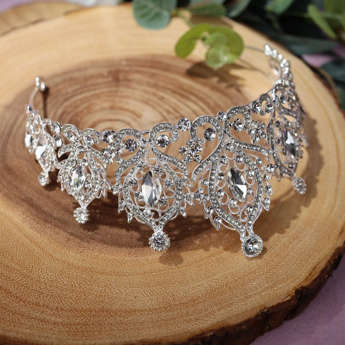 a close up of a tiara on a piece of wood