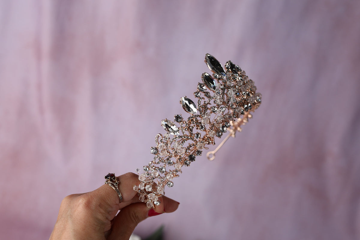 a woman holding a hair comb in her hand