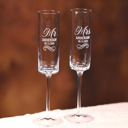two wine glasses sitting on top of a table