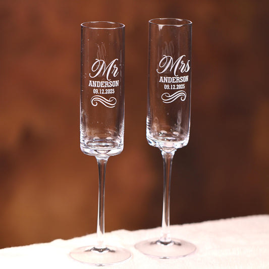 two wine glasses sitting on top of a table
