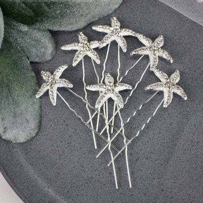 a bunch of pins sitting on top of a table