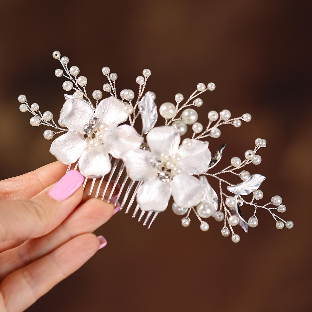 a close up of a person holding a hair comb