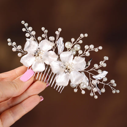 a close up of a person holding a hair comb