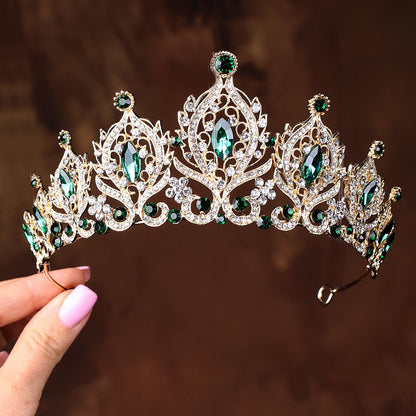 a close up of a person holding a tiara