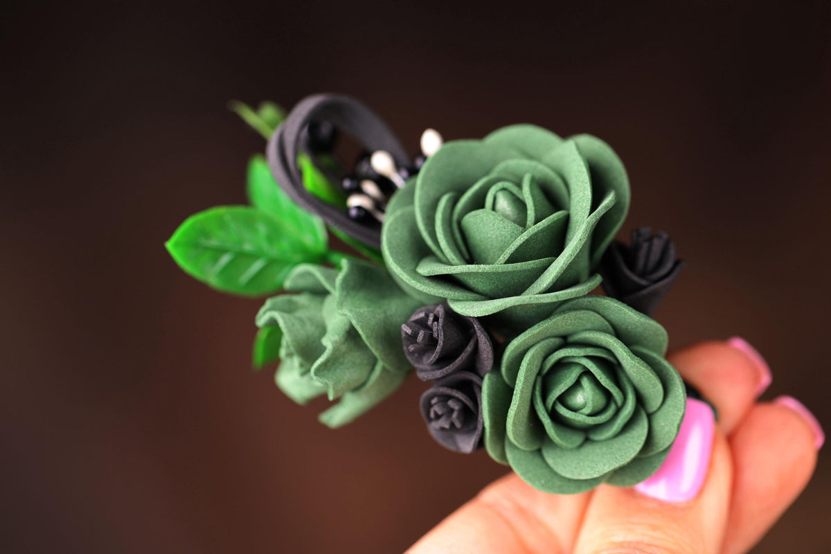 a close up of a person holding a fake flower