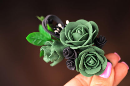 a close up of a person holding a fake flower