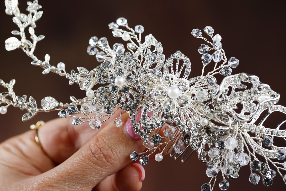 a close up of a person holding a tiara