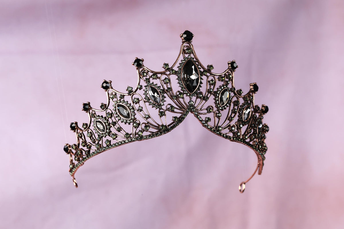 a tiara is shown on a pink background