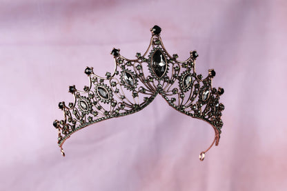 a tiara is shown on a pink background