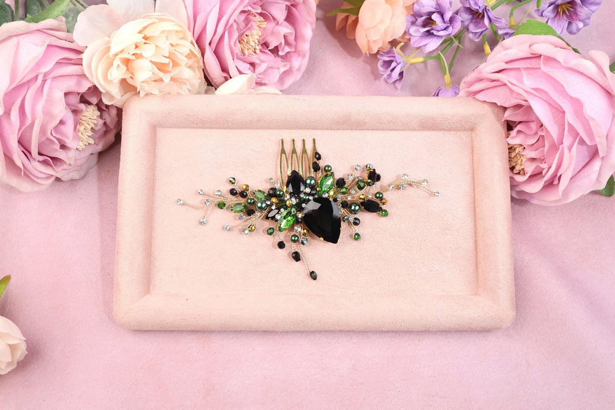 a pink plate with a black and green brooch on it