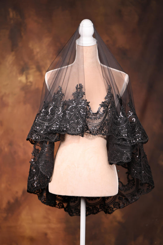 a mannequin with a veil on top of it