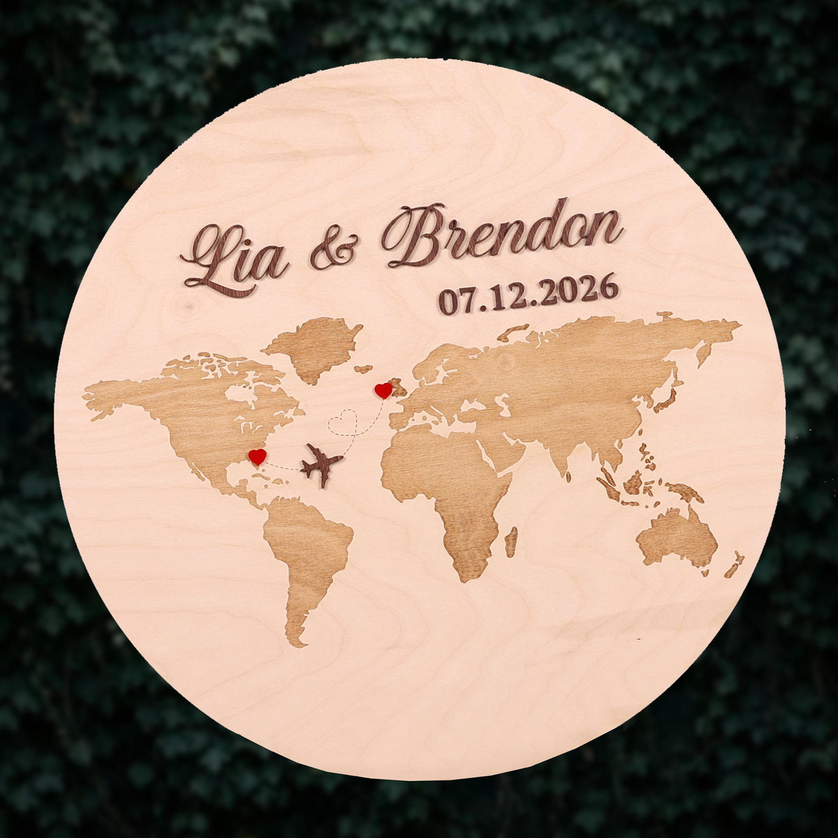 A wooden plaque with a world map and two hearts, representing the relationship between two people.