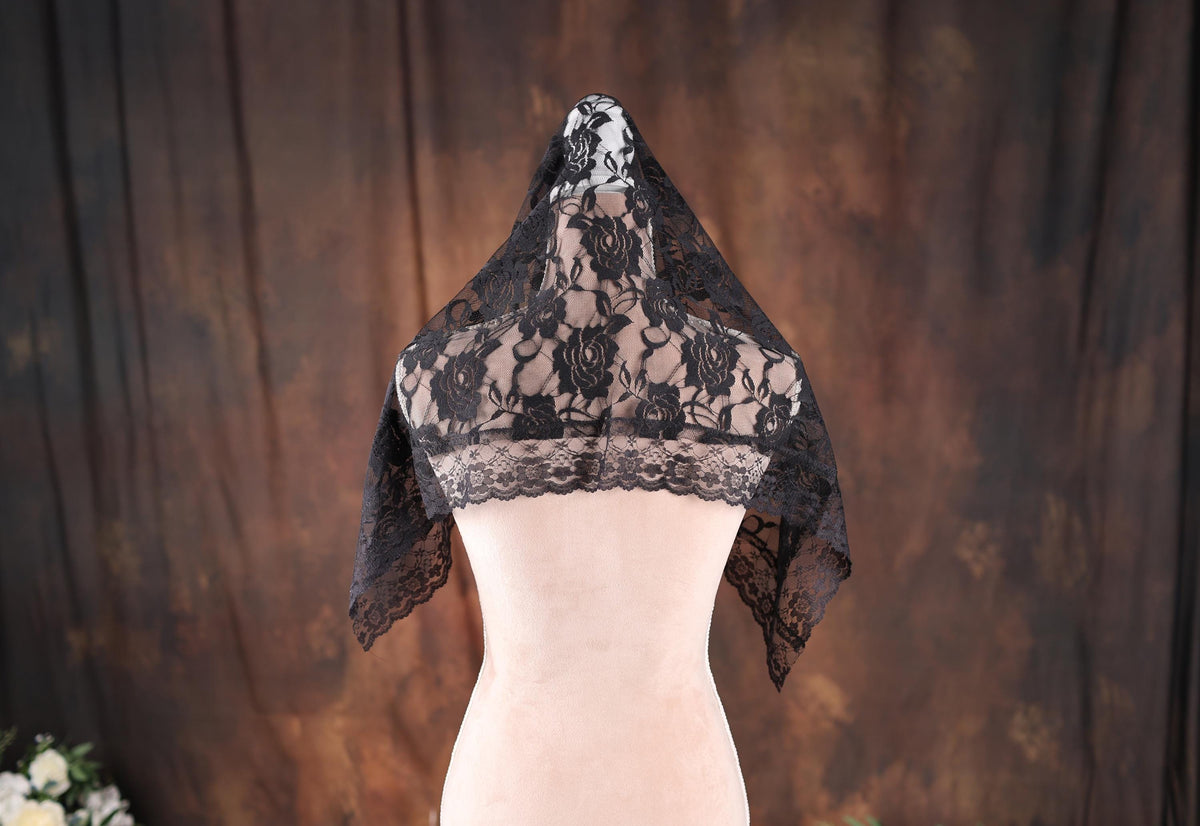 a white mannequin with a black lace top