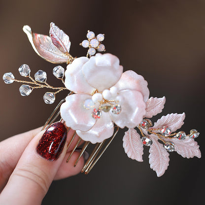 a close up of a person's hand holding a hair comb