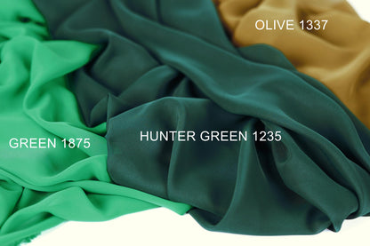 three different fabric swatches, each with a distinct color: green, olive green, and brown. The text labels the swatches with their respective colors and a reference number, "GREEN 1875", "OLIVE 1337", and "HUNTER GREEN 1235".