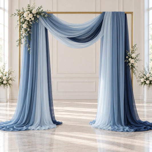 a beautifully decorated wedding arch with blue and white drapes, adorned with white flowers. The arch is set against a white background, creating a serene and elegant atmosphere for a wedding ceremony.