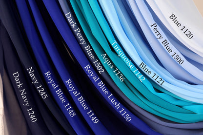 a collection of fabric swatches in various shades of blue, including navy, royal blue, turquoise, aqua, and light blue.