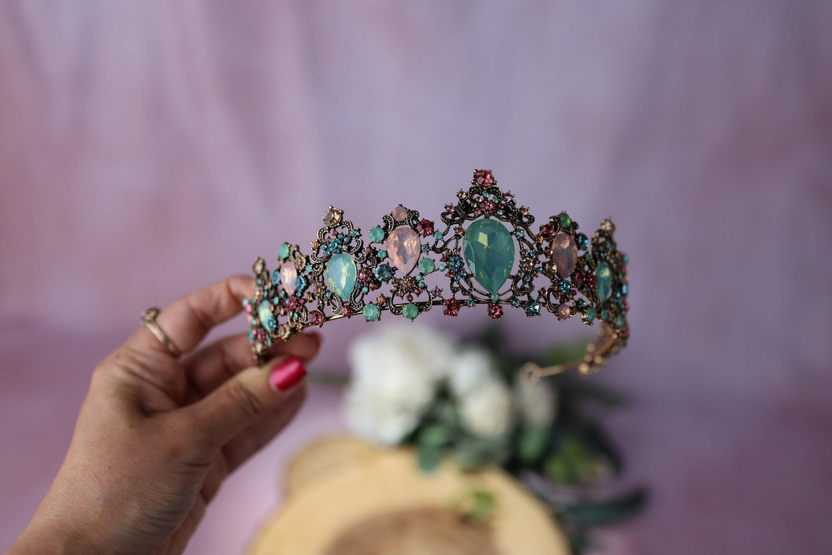 a piece of jewelry sitting on top of a piece of wood