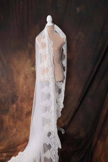 a mannequin with a white veil on top of it