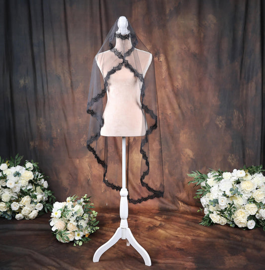 a wedding dress on a mannequin with flowers