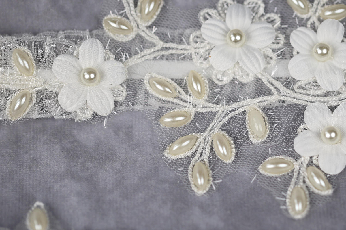 a close up of a piece of cloth with flowers on it