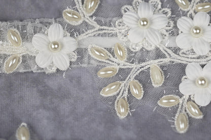 a close up of a piece of cloth with flowers on it