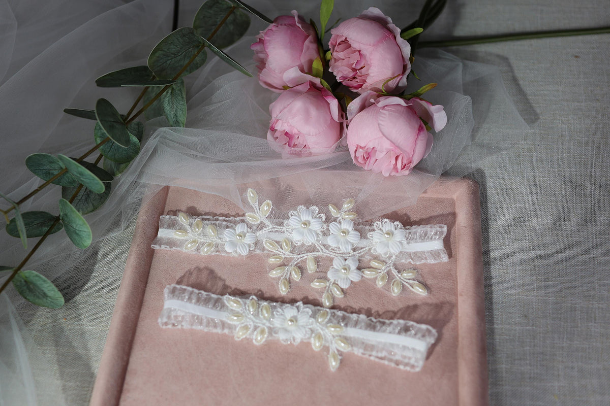 a bouquet of pink roses sitting on top of a table
