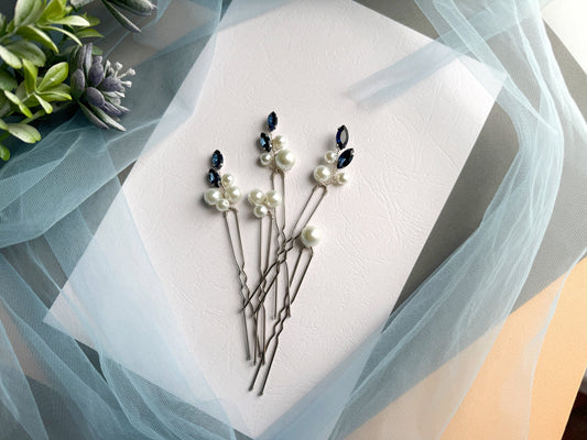 a bunch of pins sitting on top of a piece of paper