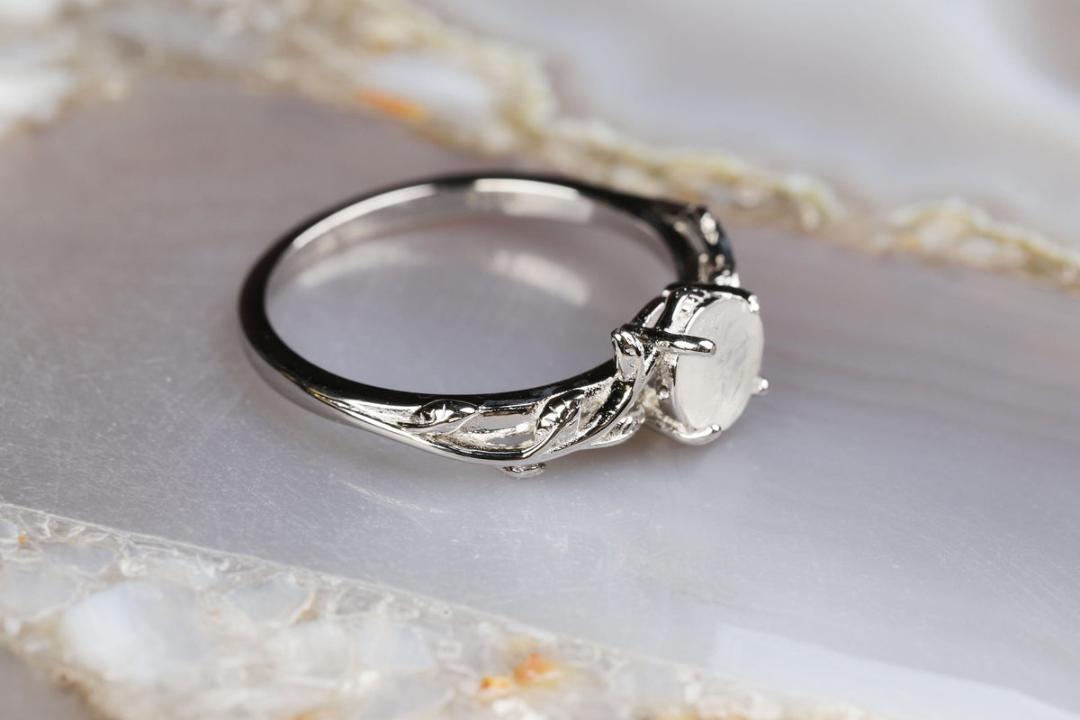 a close up of a ring on a marble surface