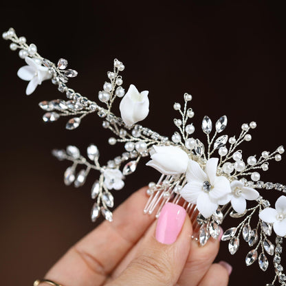 a close up of a person holding a hair comb